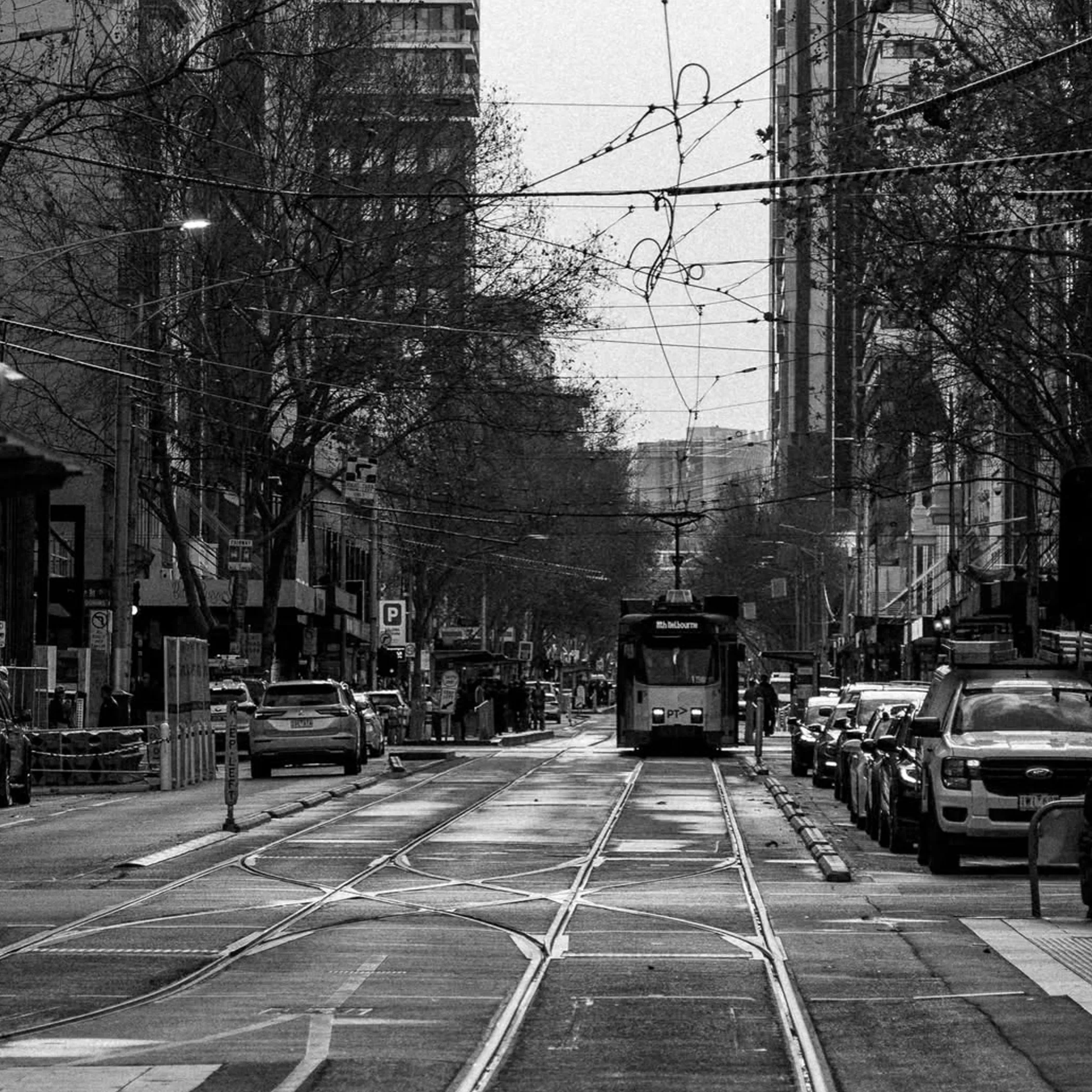 melbourne tram on tracks at night